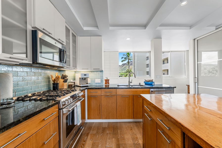 Bright, modern kitchen space with stainless steel appliances and sleek design.