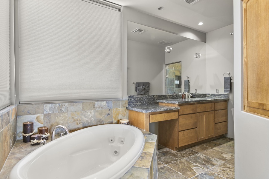 Spa-like ensuite comes with a soaking tub and lots of vanity spaces