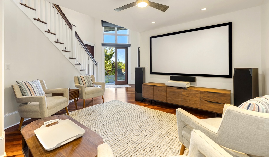 Head down the stairs and you'll also find a den with a large-screen TV and plenty of seating - Ideal for a movie night!