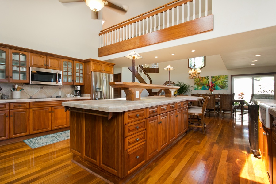 Craft your favorite dishes in a gourmet kitchen designed with rich wood finishes and ample space.
