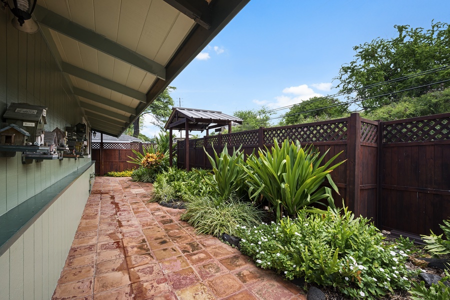Front entry, politely landscaped with tropical plants