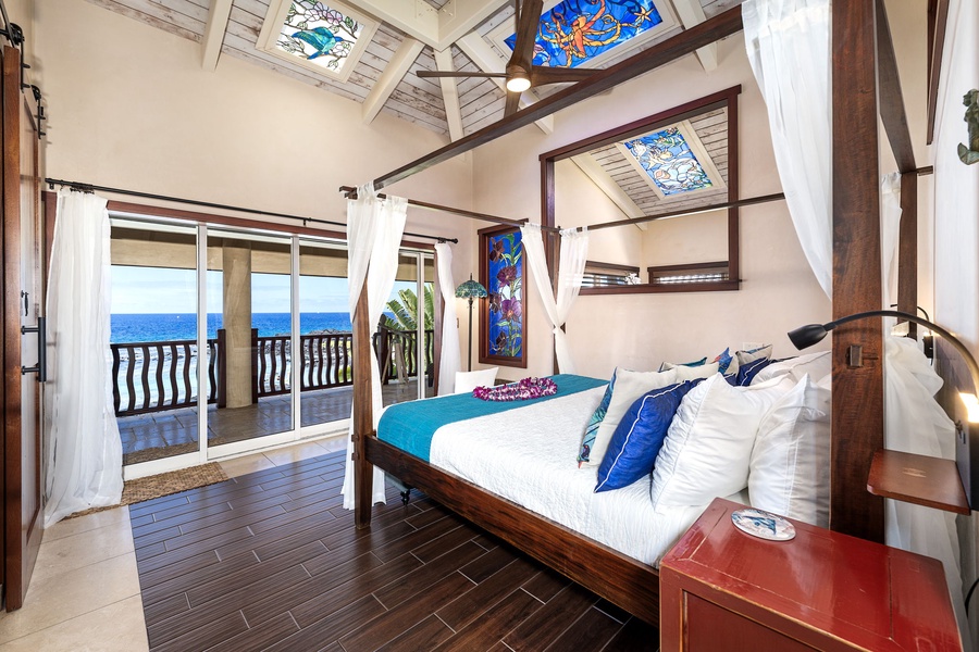 King-size canopy bed and vaulted ceilings with stained glass accents—serenity and artistry in one restful retreat.