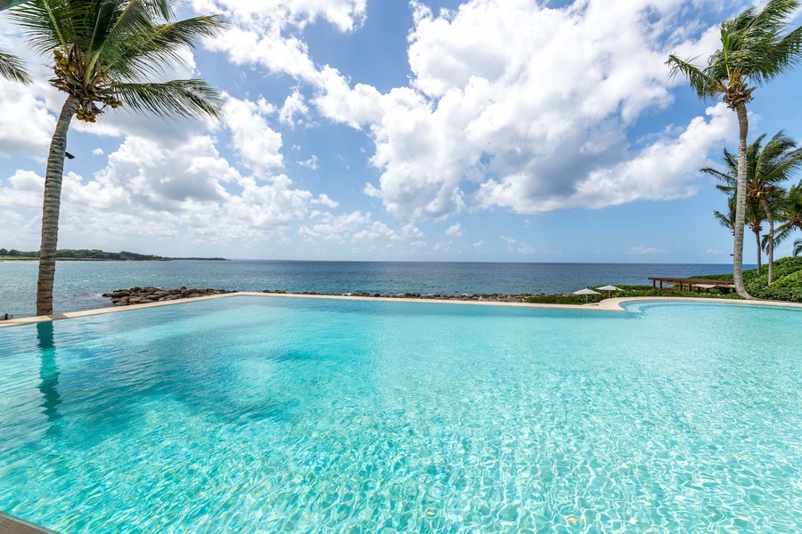 Take a dip in the sparkling infinity pool for the ultimate tropical retreat.