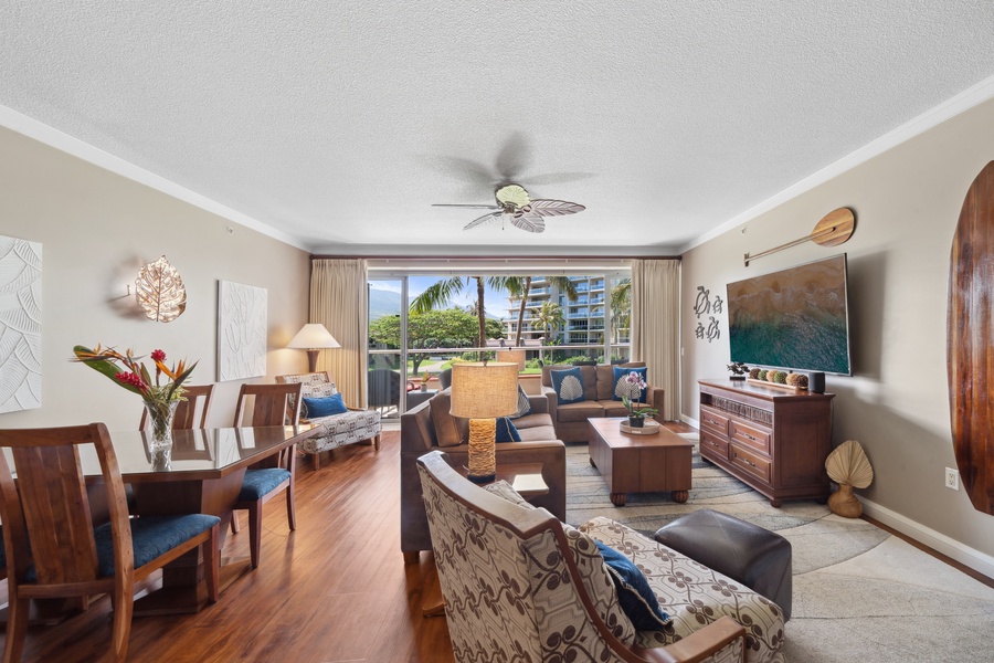 Relax in the open-concept living room at Honua Kai Konea 204, where floor-to-ceiling windows invite Maui's sunlight.