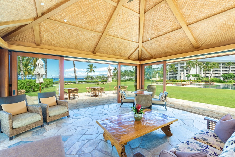 Discover tranquility and service at Pauoa Beach Club's shaded lounge with views