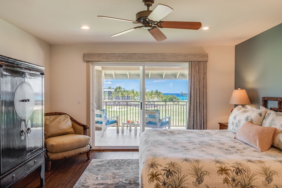 Upstairs primary bedroom w/ private lanai, king size bed and flat-screen TV
