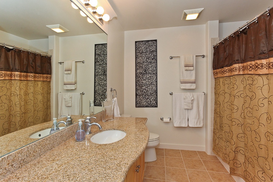 The second guest bathroom is a full bathroom with a shower.