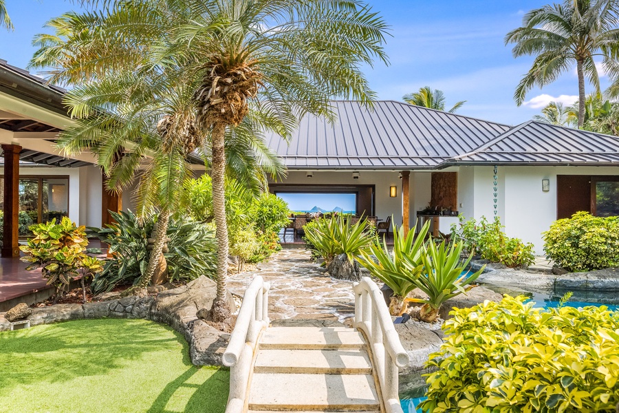 Stone paths connect serene courtyards and luxurious suites in true Hawaiian fashion.