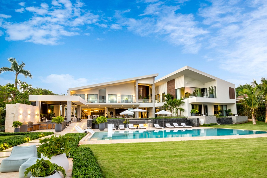Modern architectural design of this oceanfront villa, complete with expansive outdoor living spaces and infinity pool.