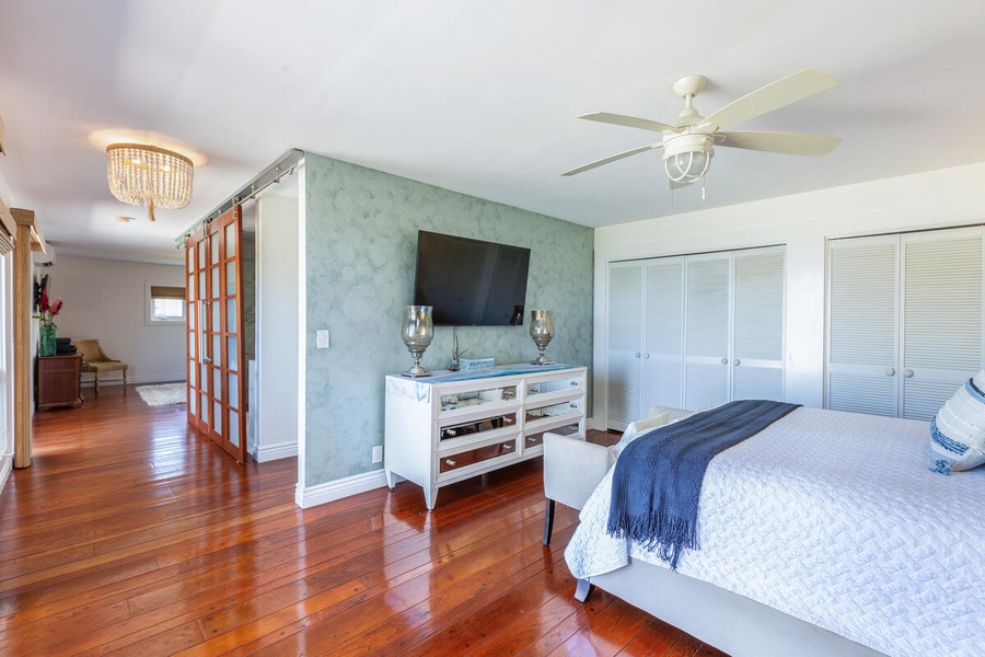 The primary bedroom has a  flat-screen TV and ensuite bathroom.