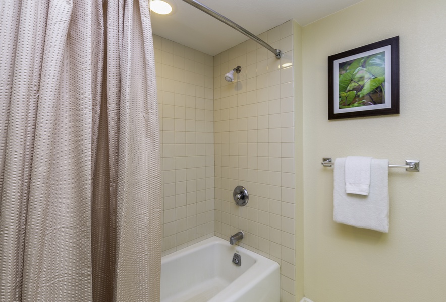 The bathroom has shower/tub combo.