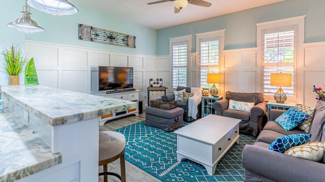 The open living area is comfortably appointed with natural lighting and nautical design.