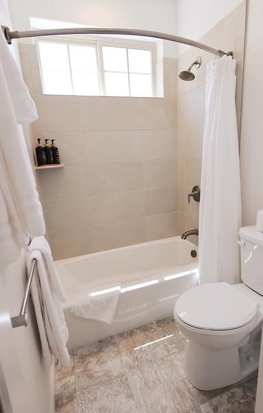 Clean, modern bathroom with full tub—refresh after beach days or relax with a soak.