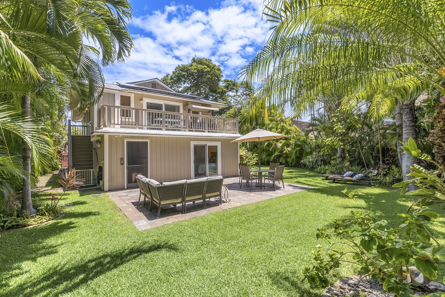 Large Private Backyard with Lush Tropical Garden and Seating areas