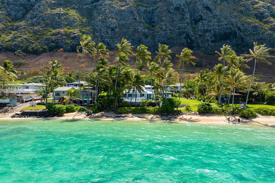 Idyllic vacation home nestled in front of Hawaii's turquoise waters, offering a serene escape to paradise.