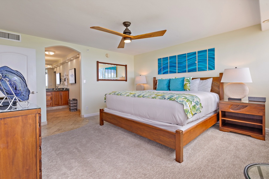 The spacious primary bedroom at Royal Kahana 610 features a comfortable king-sized bed and a calm vibe.