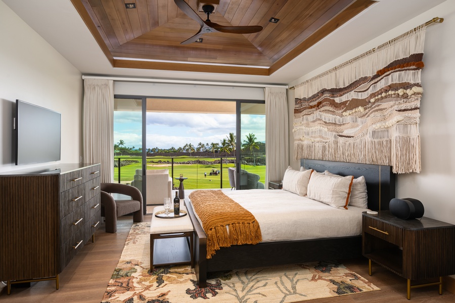 The upstairs primary suite (Bedroom 1) has a king-sized bed and ocean, mountain, and golf views from the lanai.