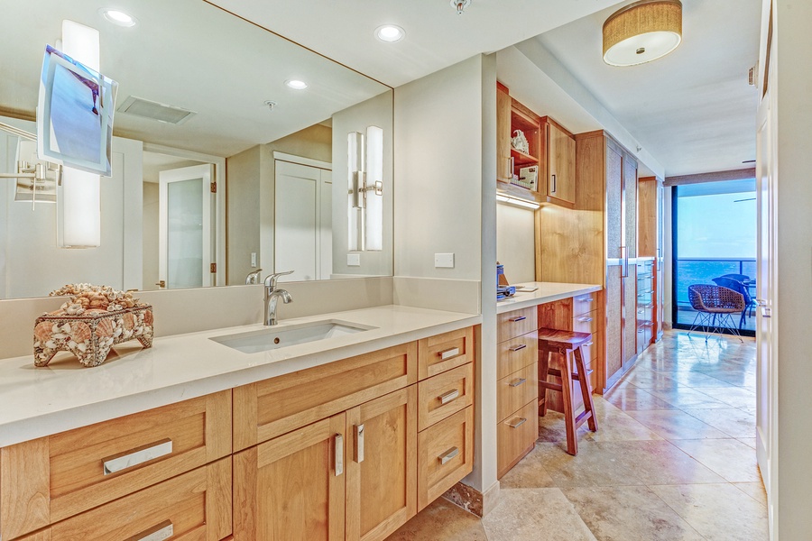 The large ensuite bathroom features a single vanity area.