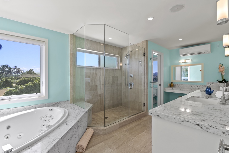 The ensuite primary bath includes a large walk-in shower