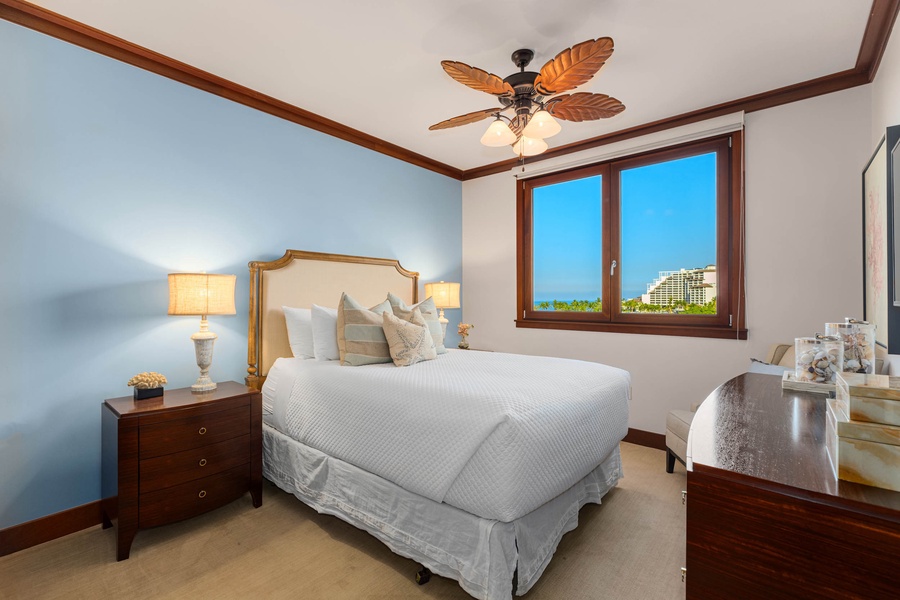 The relaxing second bedroom features luxurious queen bed.