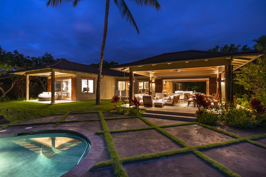 View from the pool deck toward the beautifully furnished lanais & open living space beyond