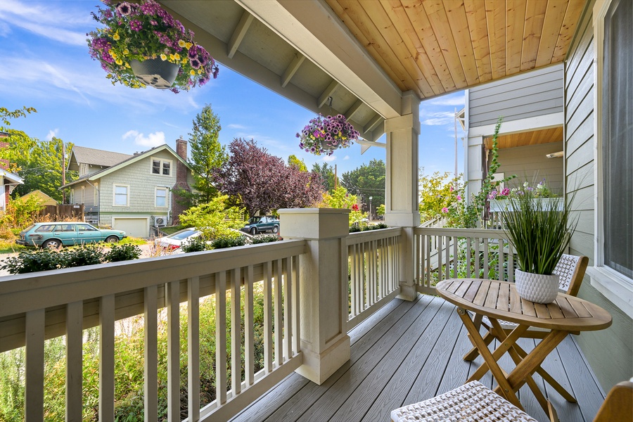 Watch the neighborhood bloom from the rocking chair on this charming covered porch.