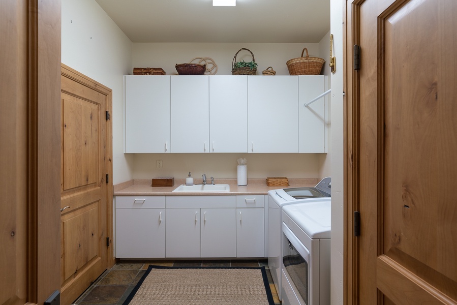 Effortlessly tackle laundry day with this roomy laundry area!