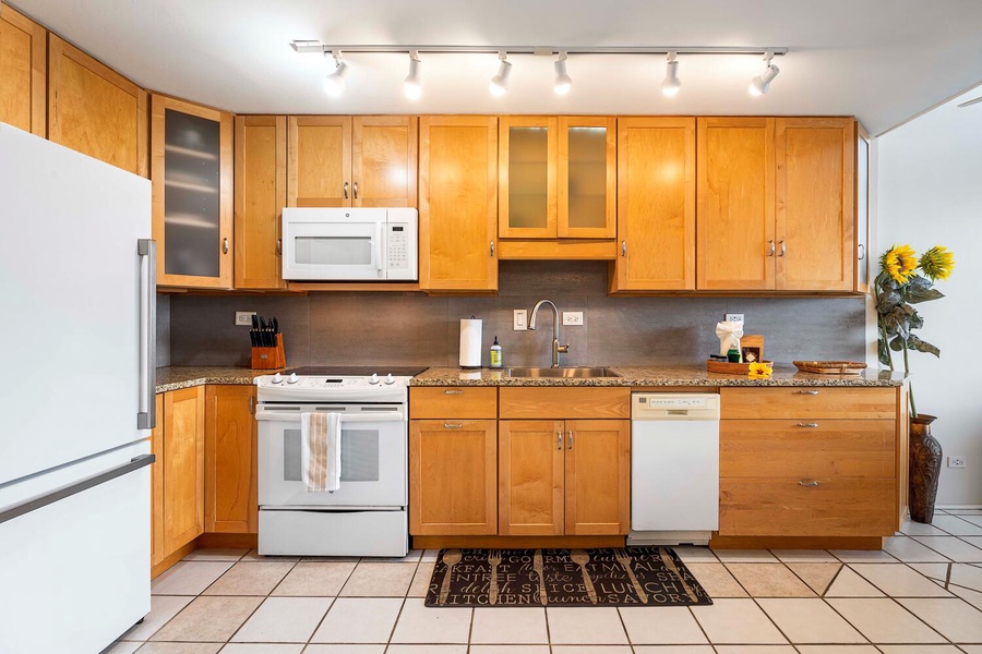 Equipped with appliances and wooden cabinetry, just all you need to prep meals.