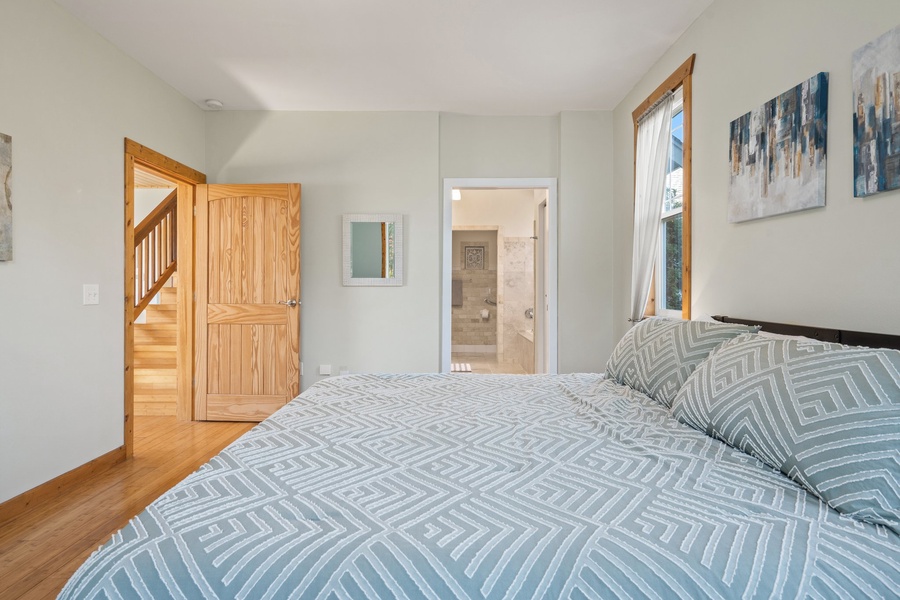 Master bedroom featuring plush and lavish linens for ultimate comfort