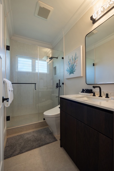 Bright bathroom with a walk-in shower and contemporary design.