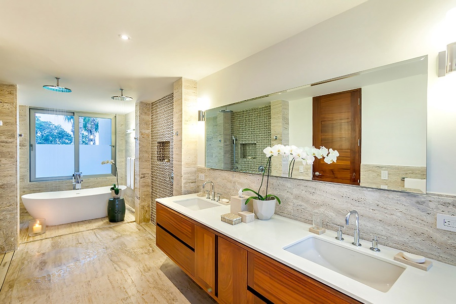 The ensuite bath has a large soaking tub and dual vanity spaces.