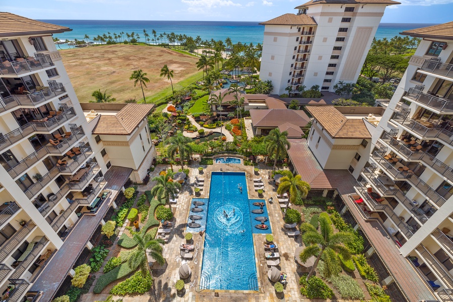 Resort pool view from the lanai with a glimpse of the ocean