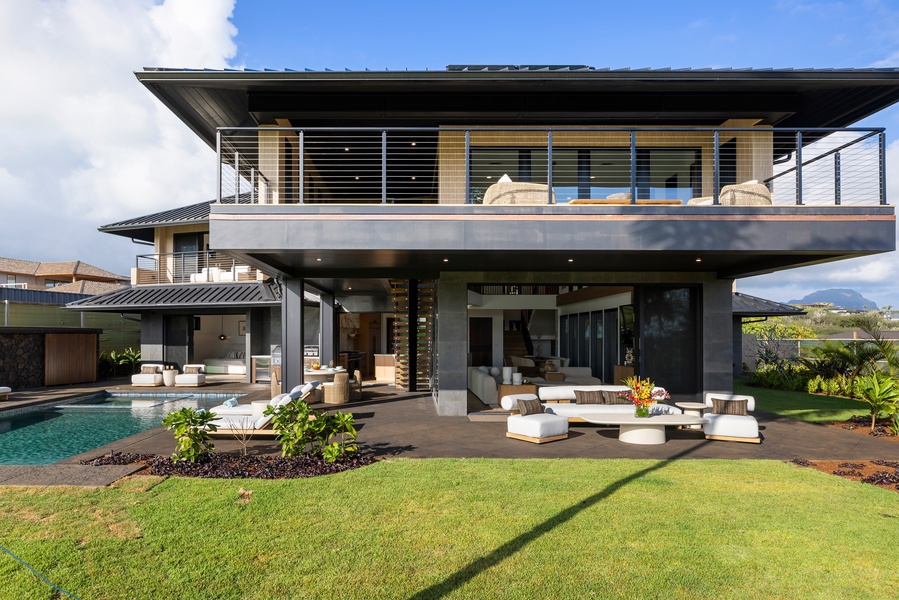 The covered lanai offers shaded retreats and open-air living designed for memorable outdoor gatherings.
