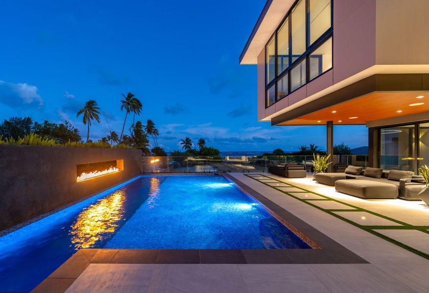 Swim under the stars in your own resort-style pool, surrounded by palm trees and open sky.