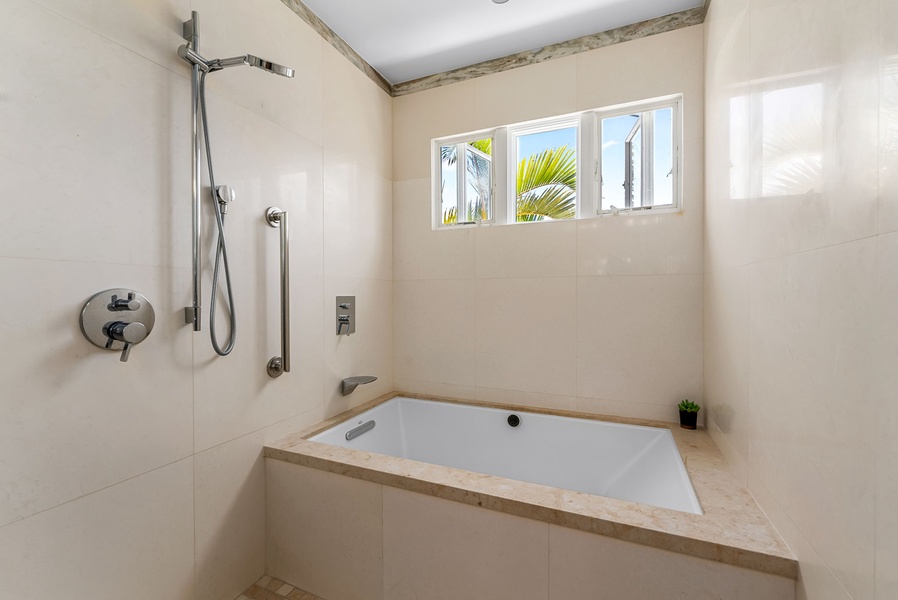 Soaking tub and shower combination make it easy to unwind after beach walks or morning hikes.