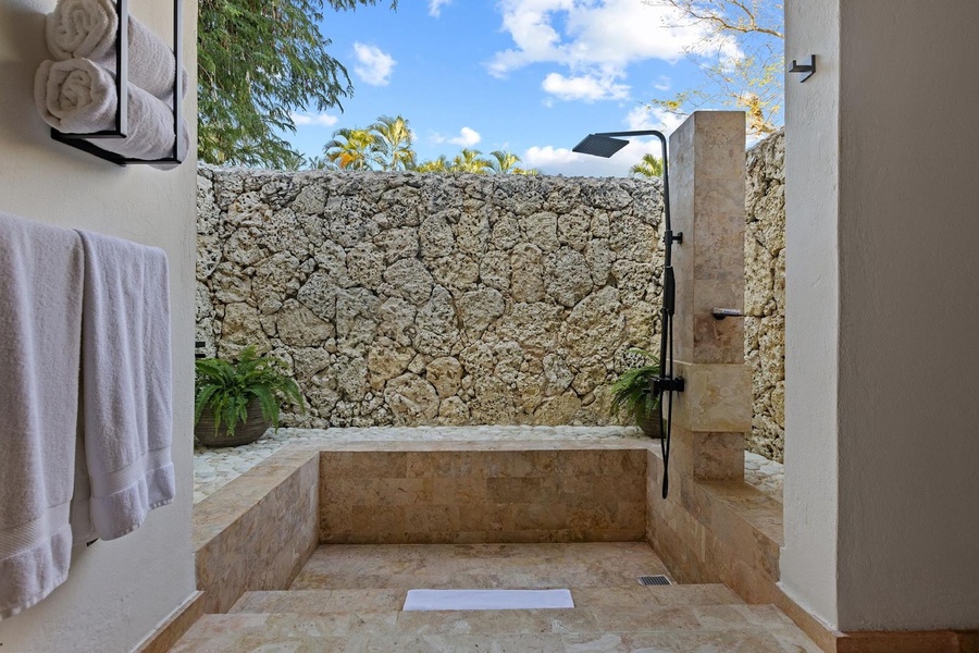 Have a refreshing and serene bathing experience in the outdoor shower area.