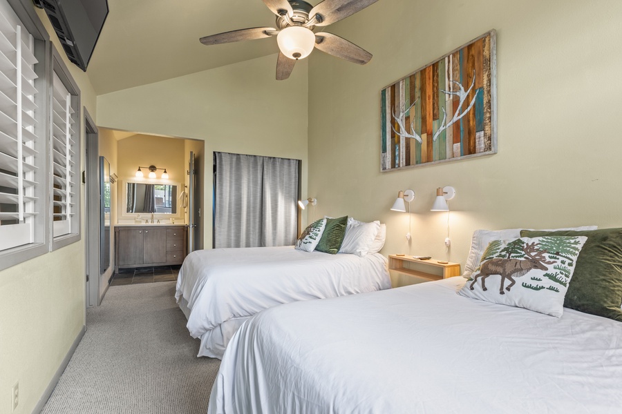 Comfortable guest suite featuring two double beds, ensuring a restful night for everyone.