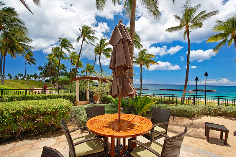 Enjoy your favorite drink on island time at the beach side tables.