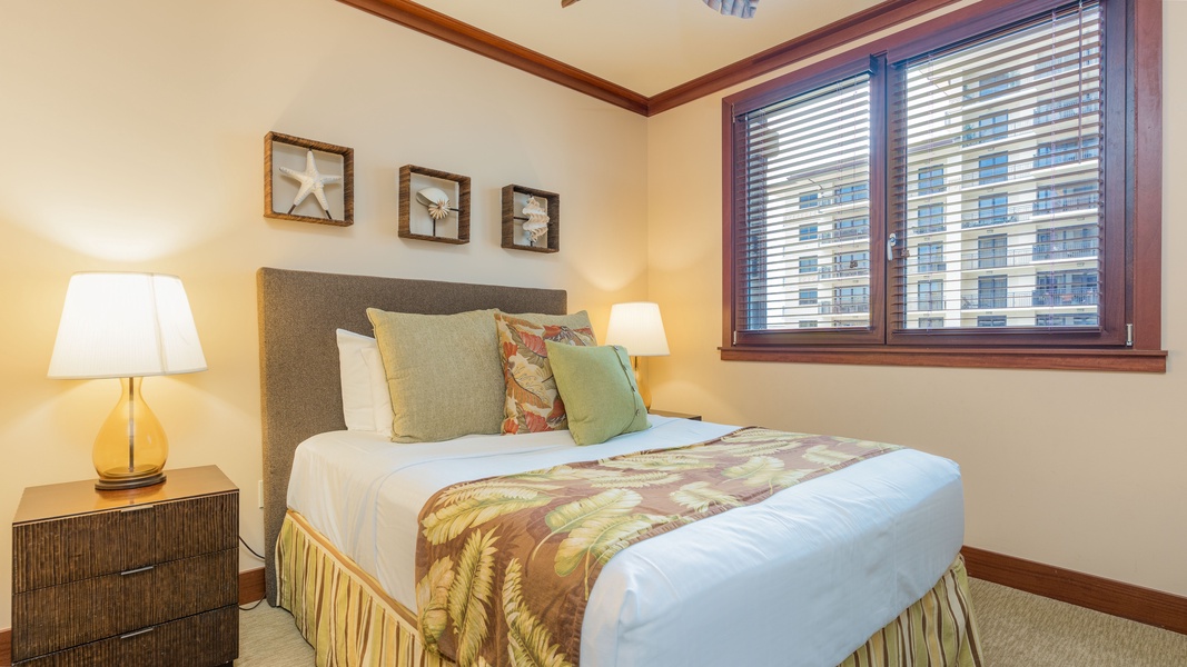 The second guest bedroom full of oceanic charm and a queen bed.