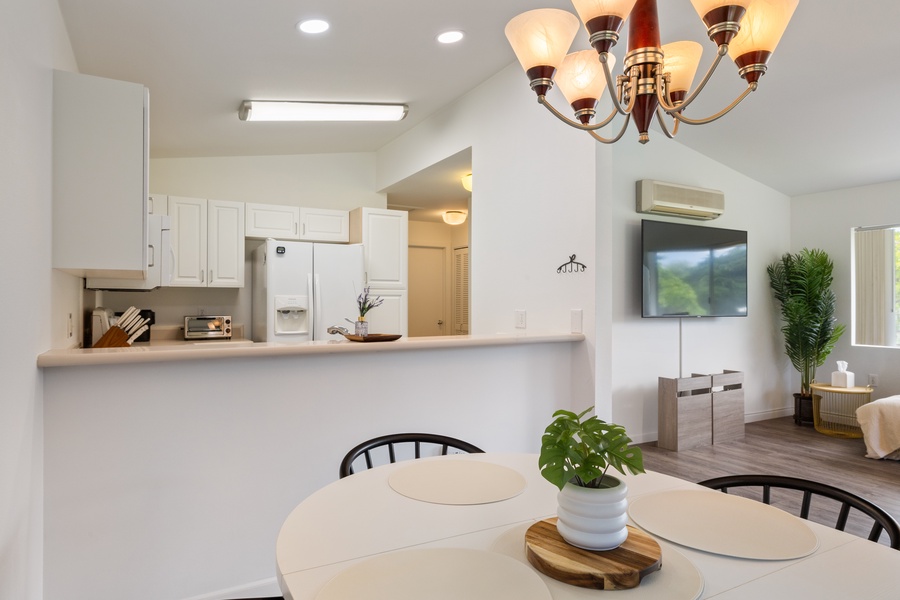 Step into your bright, open-concept space where the kitchen flows seamlessly into your dining and living areas, perfect for relaxing.