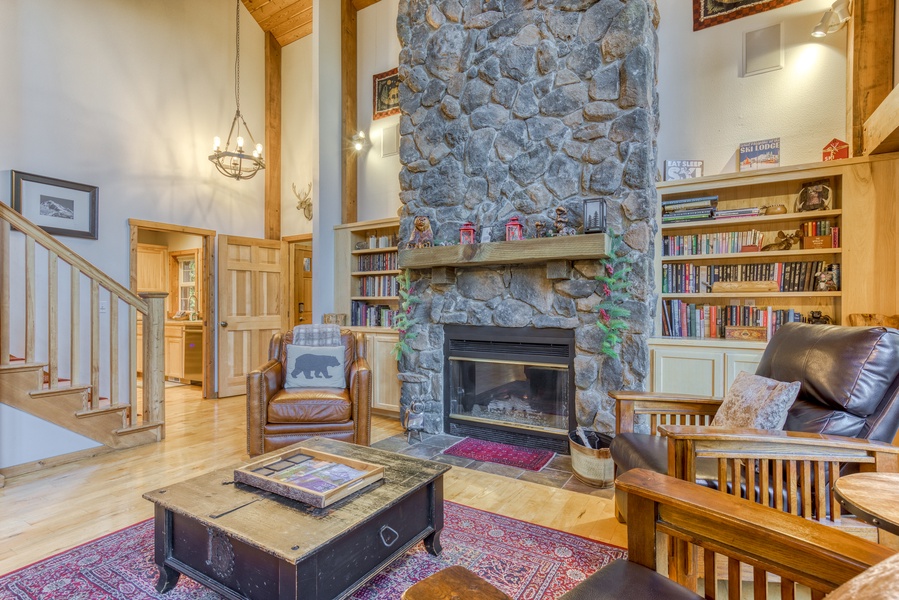 Living area with a reading nook by the fireplace, you're sure to find the perfect book.
