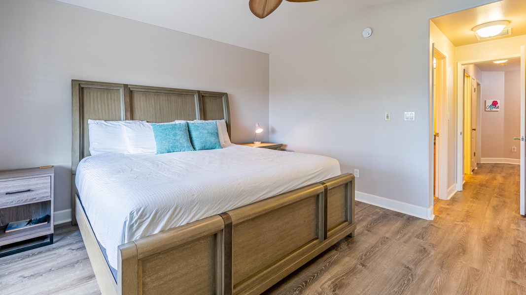 The primary guest bedroom is comfortable and spacious for a restful slumber.