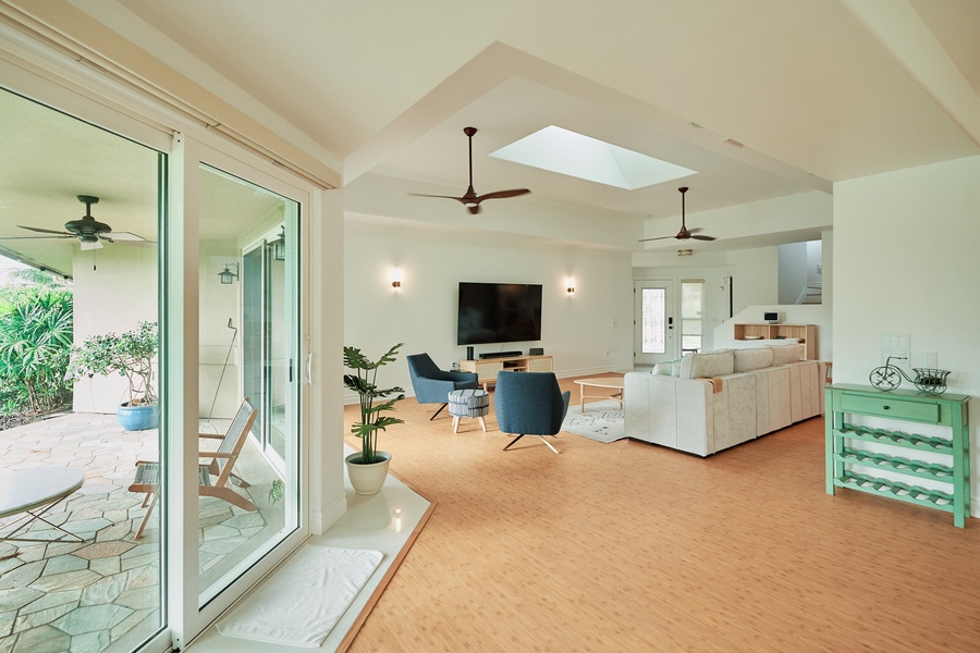 Bright, airy living space with soaring ceilings and seamless outdoor flow.