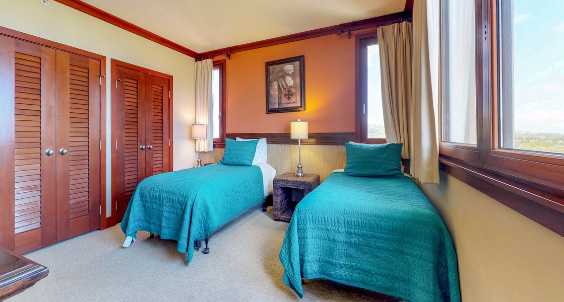 The third guest bedroom with bright views and colorful decor.