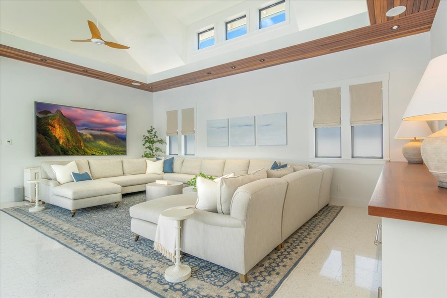 Elegant living area with vaulted ceilings, natural textures, and serene island tones.
