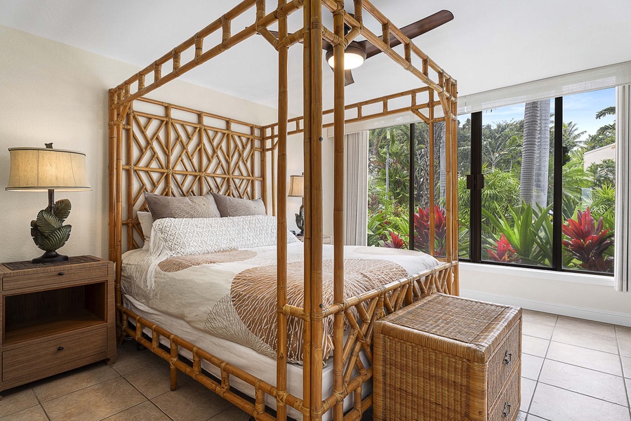 The guest bedroom’s bamboo four poster Queen-size bed is perfectly complemented by the garden views visible just outside the room’s large window.