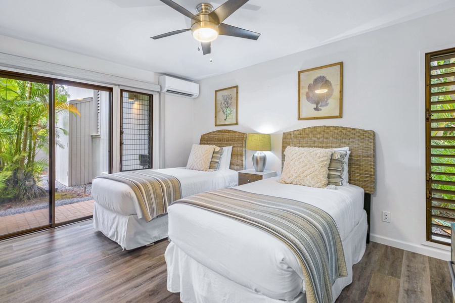 Wailea Ekolu 1605 cozy bedroom features twin beds that converts to a king bed and offers lanai access.