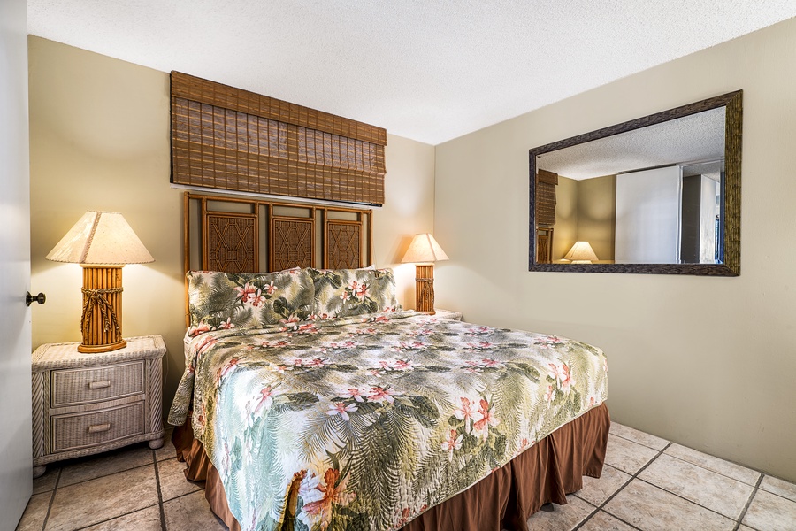 King sized bed in the tropically appointed bedroom