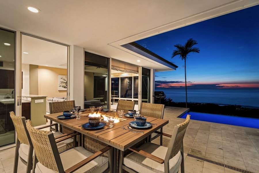 Savor dinner by firelight on the lanai while watching the sky fade into night over the Pacific.
