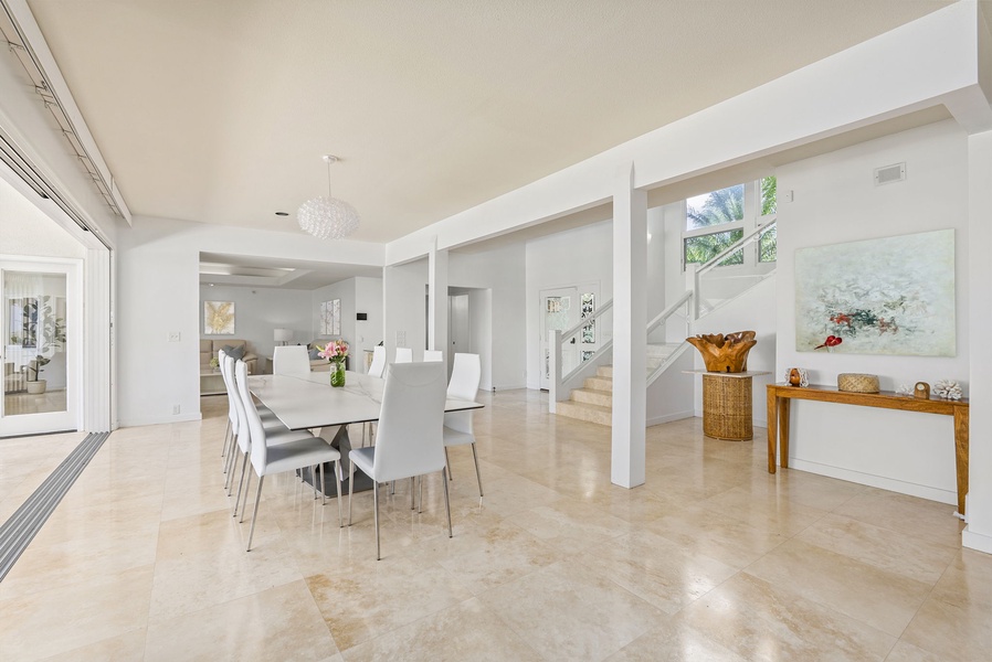 An open layout connects the dining area to the outdoors and beyond, creating a seamless setting for entertaining with ease.